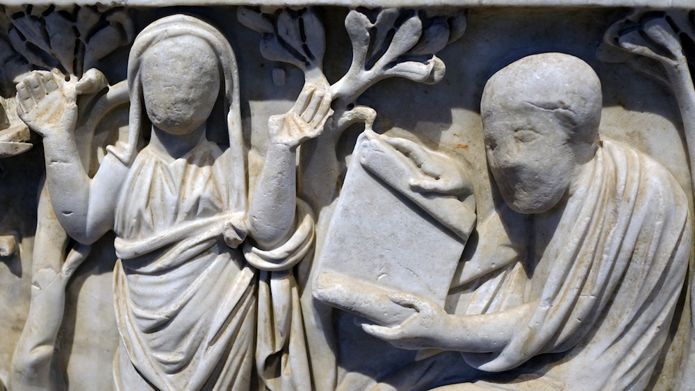 Orant and Seated figure (detail), Santa Maria Antiqua Sarcophagus, c. 275 C.E., white veined marble, found under the floor of Santa Maria Antiqua, Rome