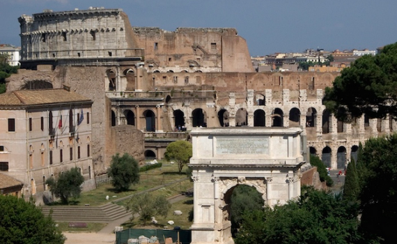 Arch of Titus (foreground) with the Colloseum in the background (photo: Steven Zucker, CC BY-NC-SA 2.0)