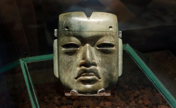 Olmec mask, c. 1200 - 400 B.C.E., jadeite, 4 x 3-3/8 x 1-1/4 inches found in offering 20 buried c. 1470 C.E. at the Aztec Templo Mayor (Museo del Templo Mayor, Mexico City)