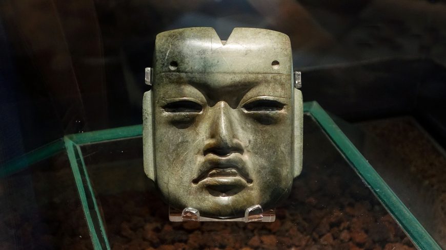 Olmec-style mask, c. 1200–400 B.C.E., found in offering 20 buried c. 1470 C.E. at the Mexica Templo Mayor, jadeite, 4 x 3-3/8 x 1-1/4 inches (Museo del Templo Mayor, Mexico City; photo: Steven Zucker, CC BY-NC-SA 2.0)