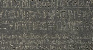 The Rosetta Stone, 196 B.C.E., Ptolemaic Period, 112.3 x 75.7 x 28.4 cm, Egypt © Trustees of the British Museum. Part of grey and pink granodiorite stela bearing priestly decree concerning Ptolemy V in three blocks of text: Hieroglyphic (14 lines), Demotic (32 lines) and Greek (53 lines).