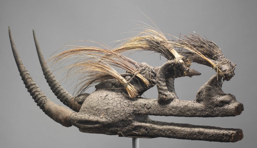 Kòmò Helmet Mask (Kòmòkun), 19th–mid-20th century, Mali or Burkina Faso or Côte d'Ivoire, West Africa, Komo or Koma Power Association, wood, bird skull, porcupine quills, horns, cotton, sacrificial materials, 35.2 x 22.1 x 85.6 cm (The Metropolitan Museum of Art)