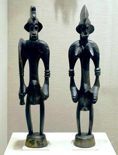 Male and Female Poro Altar Figures (Ndeo), 19th–mid-20th century, Senufo peoples, Korhogo region, Bandama River region, Côte d'Ivoire, wood, pigment, 60.2 x 14 x 11.8cm (The Metropolitan Museum of Art)