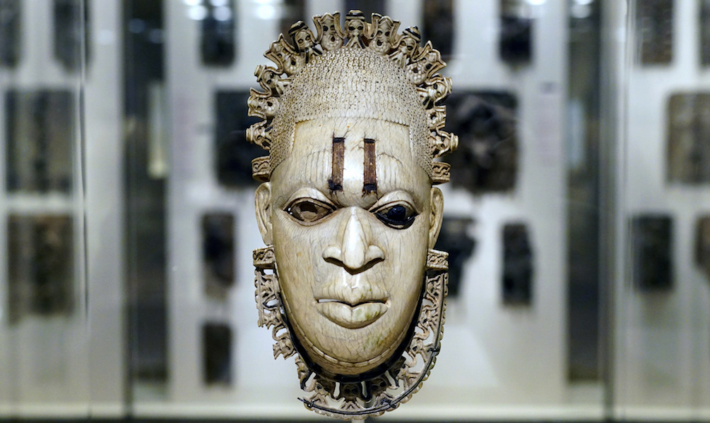 Queen Mother Pendant Mask (Iyoba), 16th century, Edo peoples, Court of Benin, Nigeria, ivory, iron, copper, 23.8 x 12.7 x 8.3 cm (The Metropolitan Museum of Art)