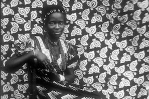 Seydou Keïta, Untitled [Seated Woman with Chevron Print Dress], 1956, printed 1997, Mali, Bamako, gelatin silver print, 60.96 x 50.8 cm (The Metropolitan Museum of Art)