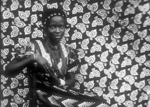 Seydou Keïta, Untitled [Seated Woman with Chevron Print Dress], 1956, printed 1997, Mali, Bamako, gelatin silver print, 60.96 x 50.8 cm (The Metropolitan Museum of Art)