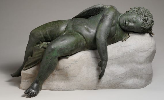 Bronze statue of Eros sleeping, 3rd–2nd century B.C.E., bronze, 16 1/2 × 14 × 33 9/16″ / 41.9 × 35.6 × 85.2 cm (The Metropolitan Museum of Art).