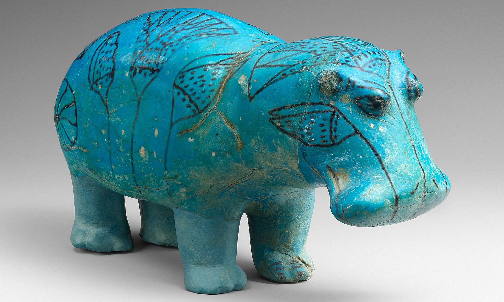 Standing Hippopotamus, ca. 1961–1878 B.C.E., Egypt, Middle Kingdom, faience, 7 7/8″ x 2 15/16″ x 4 7/16″ / 20 cm x 7.5 cm x 11.2 cm (The Metropolitan Museum of Art).