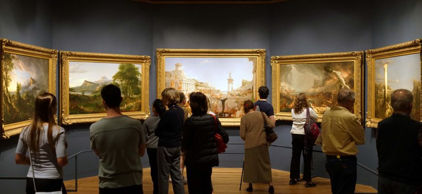Visitors in a Thomas Cole exhibition at The Met view The Course of Empire