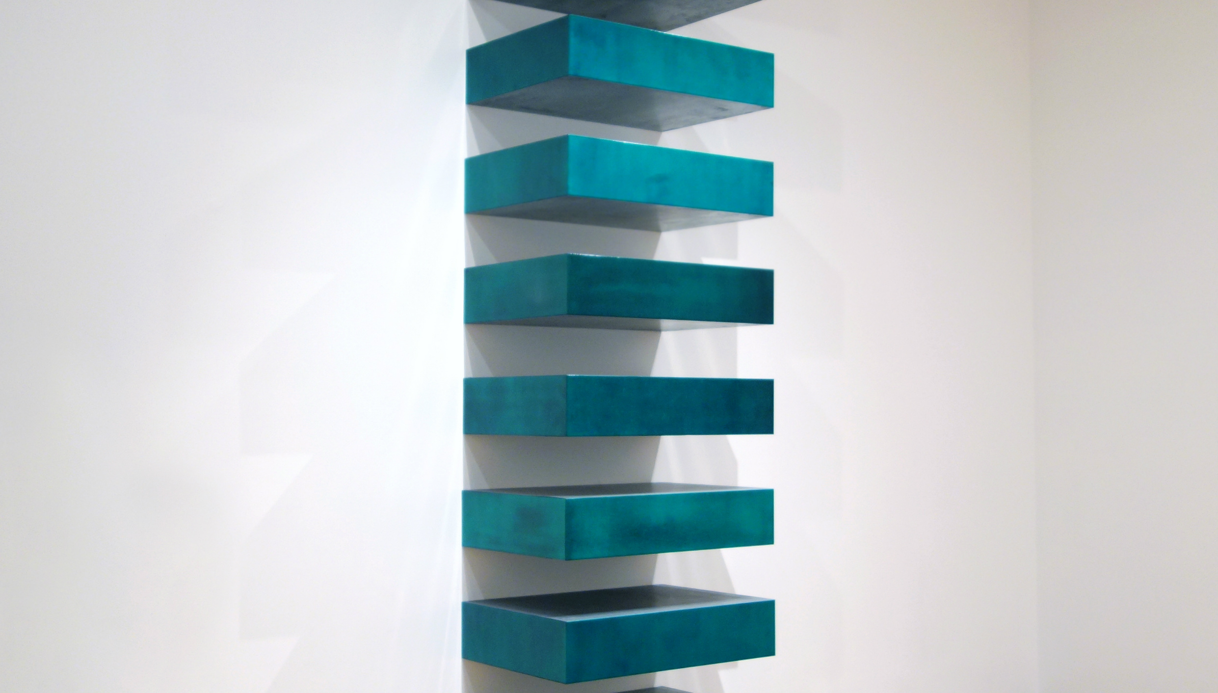 Donald Judd, Untitled (Stack), 1967, lacquer on galvanized iron, twelve units, each 22.8 x 101.6 x 78.7 cm, installed vertically with 9" (22.8 cm) intervals (MoMA)
