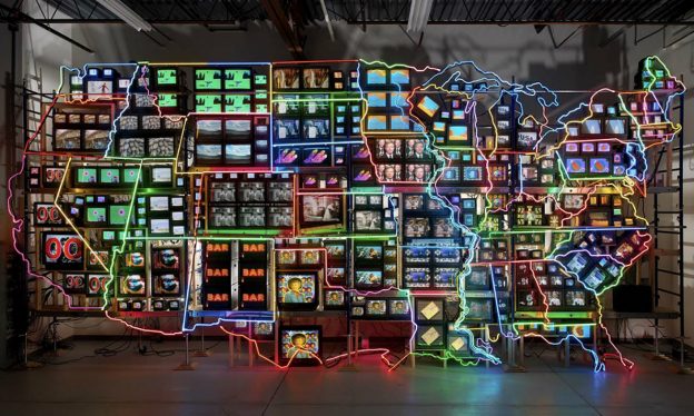 Nam June Paik, Electronic Superhighway: Continental U.S., Alaska, Hawaii, 1995, fifty-one channel video installation (including one closed-circuit television feed), custom electronics, neon lighting, steel and wood; color, sound, approx. 15 x 40 x 4' (Smithsonian American Art Museum) (© Nam June Paik Estate)