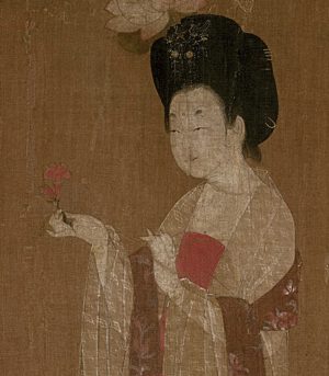 Woman holding a flower (detail), attributed to Zhou Fang (active late 8th–early 9th century), Ladies Wearing Flowers in Their Hair, handscroll, ink and color on silk, 46 x 180 cm (Liaoning Provincial Museum, Shenyang province, China)