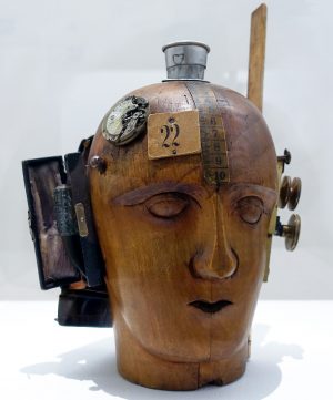 Raoul Hausmann, Mechanical Head (Spirit of Our Age), 1919, hairdresser's dummy, pocket watch and camera parts, tape measure, telescopic tumbler, leather case, cardboard bearing the number 22, and other materials, 32.5 x 21 x 20 cm (Center Pompidou, Paris)
