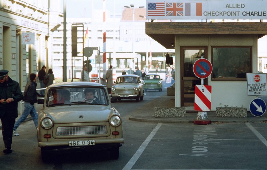 East Germans drive through Checkpoint Charlie after the fall of the Berlin Wall, 1989 (photo: Staff Sergeant F. Lee Cockran, CC0)