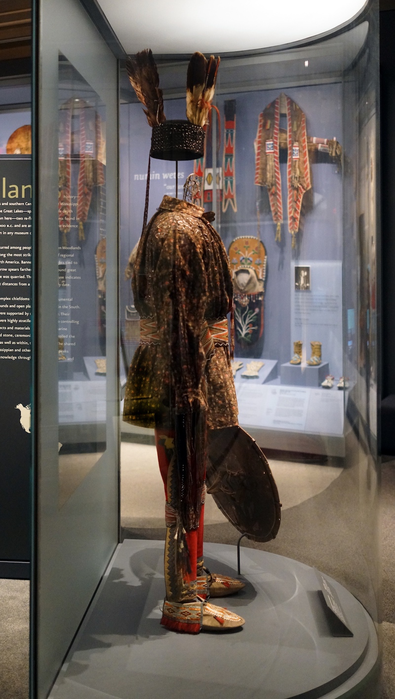 Anishinaabe outfit, c. 1790, collected by Lieutenant Andrew Foster, Fort Michilimackinac (British), Michigan, Birchbark, cotton, linen, wool, feathers, silk, silver brooches, porcupine quills, horsehair, hide, sinew; the moccasins were likely made by the Huron–Wendat people (National Museum of the American Indian, Smithsonian Institution)