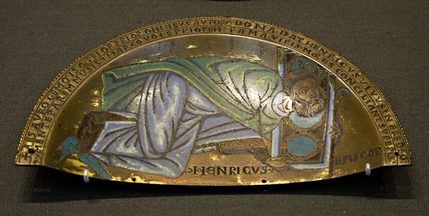 Henry of Blois, the bishop of Winchester presenting a portable altar, before 1171, semi-circular plaque (part of a set of two), copper alloy, champlevé, gilding, 18.2 cm (The British Museum)