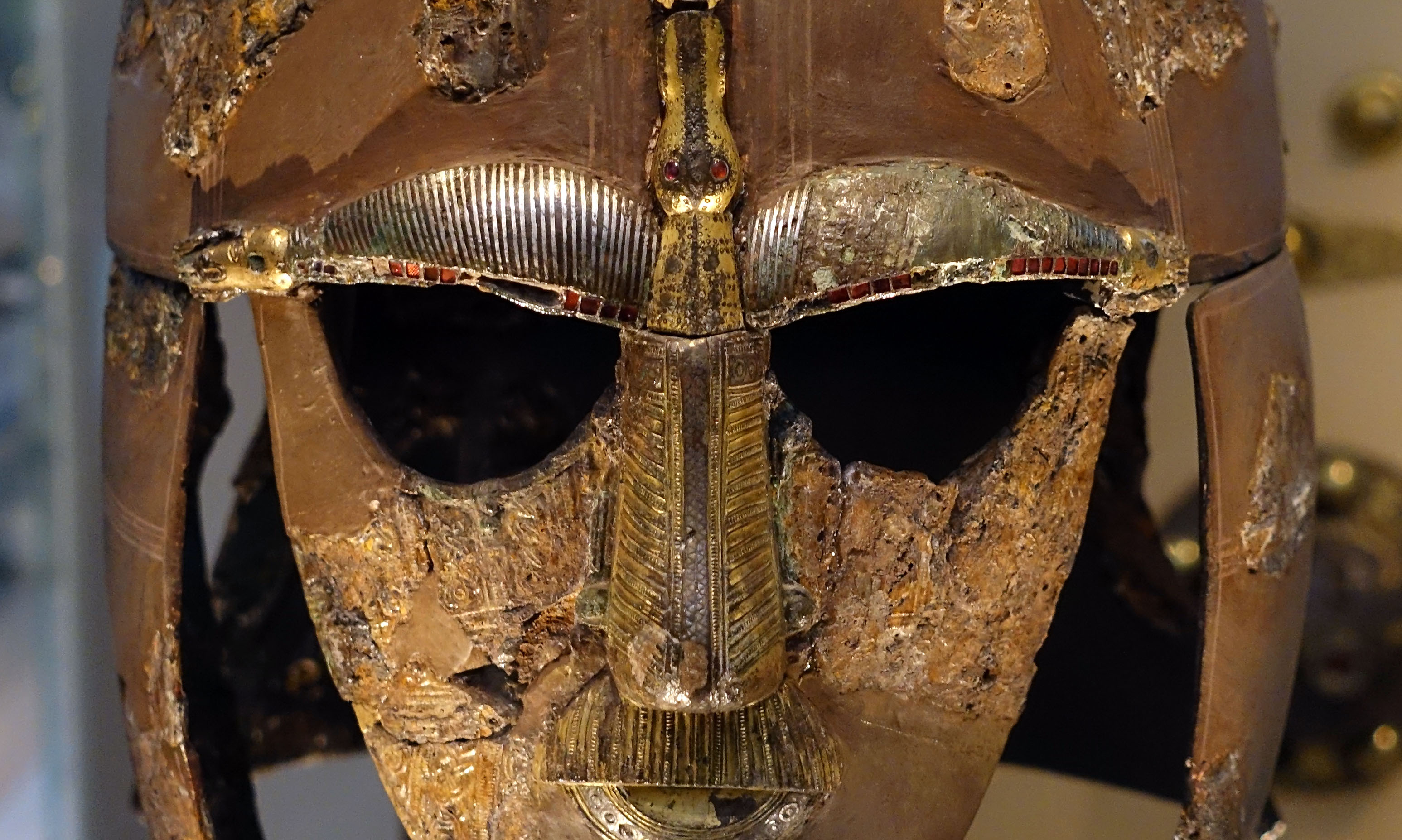 Sutton Hoo ship-burial helmet, iron, copper alloy, gold, tin, garnet, and silver, c. 600-650 C.E., 31.8 x 21.5 x 25.5 (The British Museum)