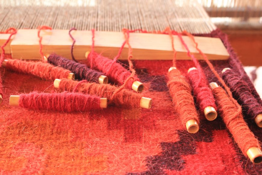 Cochineal yarn used in a weaving in Teotitlán del Valle, Oaxaca. (photo: Sarahh Scher, CC BY-SA 3.0)