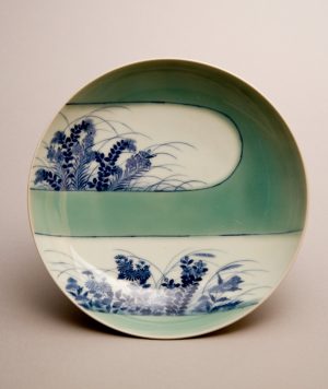 Plate with design of autumn grasses and lozenge-shaped mist, Nabeshima ware, porcelain with underglaze cobalt blue and celadon glaze, dia. 20.32 cm (Minneapolis Institute of Art)