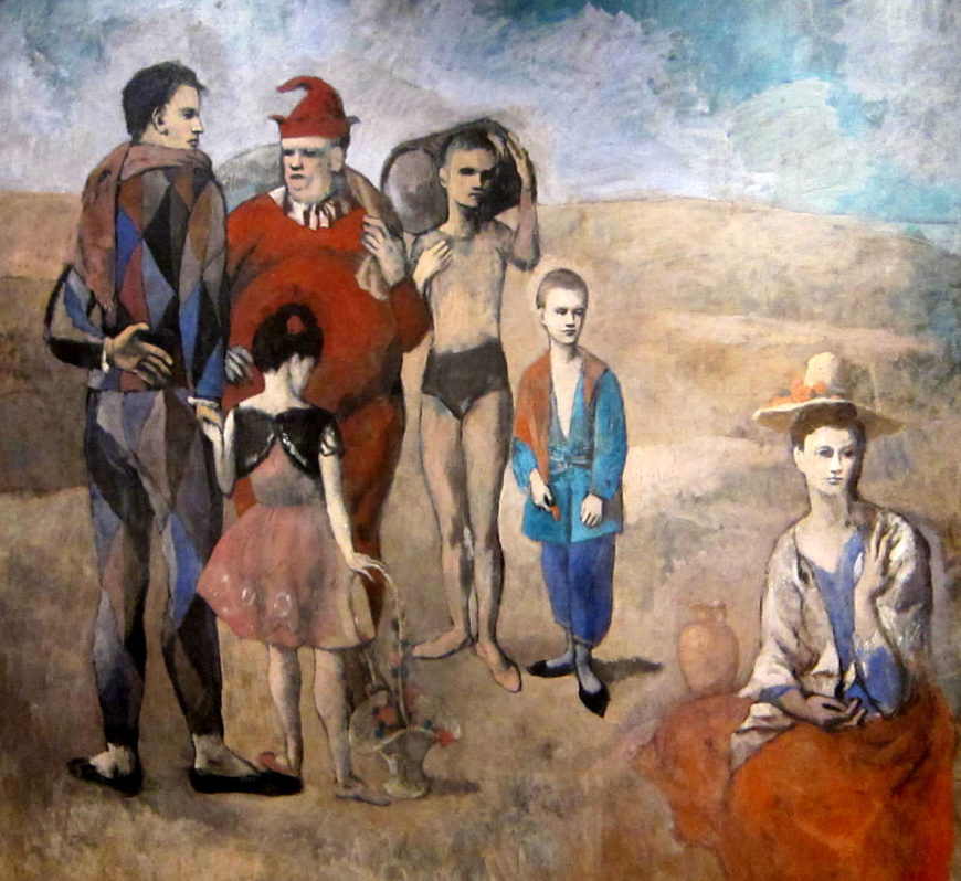 https://smarthistory.org/wp-content/uploads/2019/11/Family_of_Saltimbanques-870x798.jpg