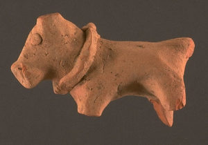 Dog from Harappa, 2600 - 1900 B.C.E., terracotta, 1.9 x 5.3 x 3.3 cm (© Richard H. Meadow, Department of Archaeology and Museums, Government of Pakistan)