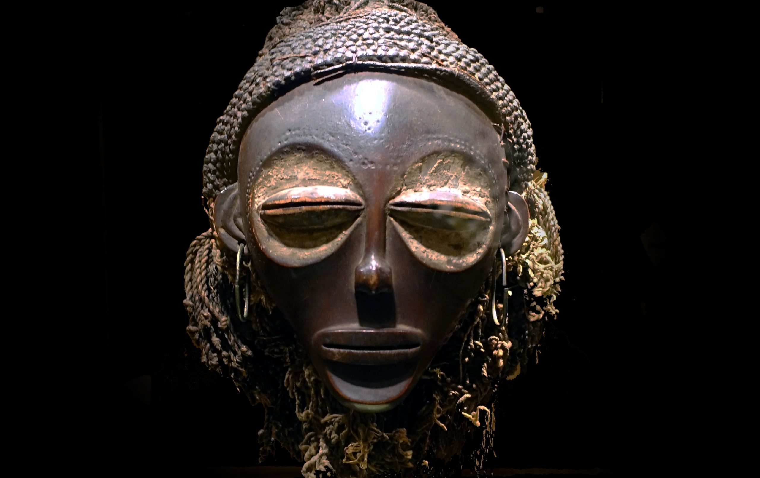 Female (pwo) mask, Chokwe peoples, Democratic Republic of Congo, early 20th century, wood, plant fiber, pigment, copper alloy, 39.1 cm high (Smithsonian National Museum of African Art)