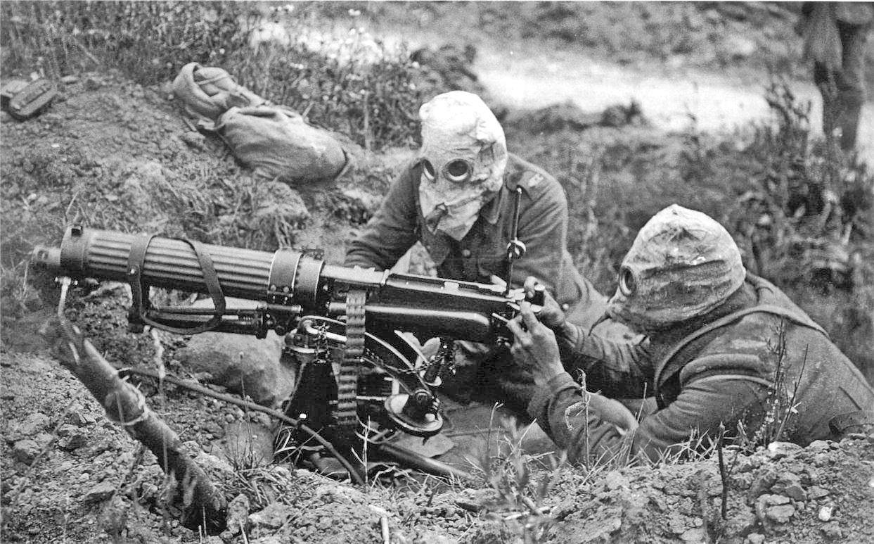 British soldiers with a Vickers machine gun wearing PH-type anti-gas helmets during the Battle of the Somme, July 1916 (Imperial War Museums) 