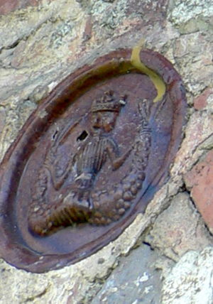 Two-tailed mermaid, glazed ceramic disc, outer wall, St. Nicholas Church, Balinesti, 1499 (image: Vlad Bedros, detail)