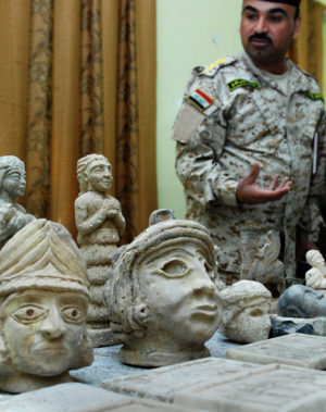 Iraqi Col. Ali Sabah, commander of the Basra Emergency Battalion, displays ancient artifacts Iraqi Security Forces discovered Dec. 16, 2008, during two raids in northern Basra