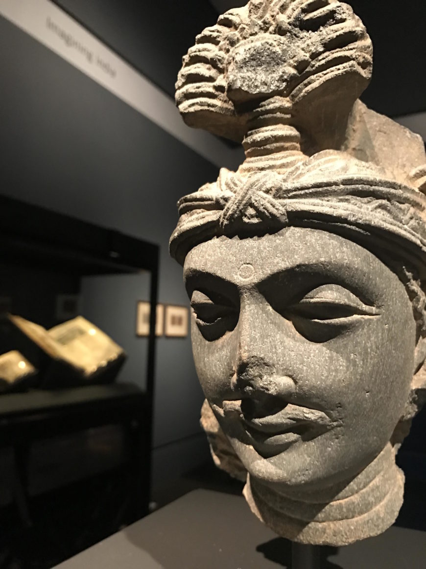 Head of a Bodhisattva, third century, made in Gandhara. Schist, 9 in. high. The J. Paul Getty Museum, Gift of Dr. Sidney and Idelle Port, 83.AJ.390
