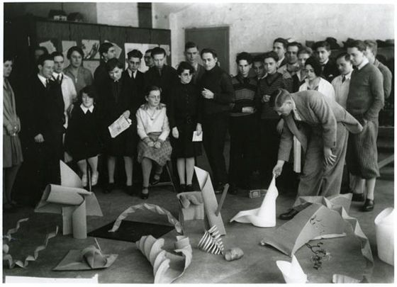 Josef Albers giving a critique of student exercises in his Vorkurs class, 1928