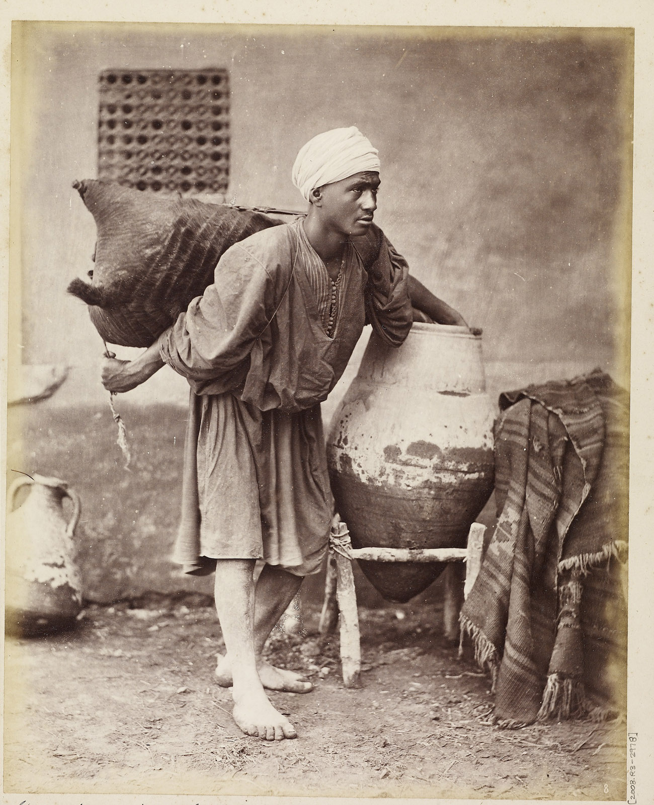 Sakkah (water carrier), Egypt, about 1872, Otto Schoefft. Albumen print mounted on period card, 24.7 x 19.5 cm. The Getty Research Institute, 2008.R.3. Ken and Jenny Jacobson Orientalist Photography Collection