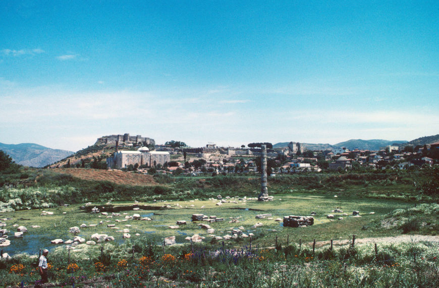 Ephesus, view looking eastward, with the ruins of the Temple of Artemis in the foreground and the hill of Ayasoluk with the Church of St. John in the distance (© Robert Ousterhout)