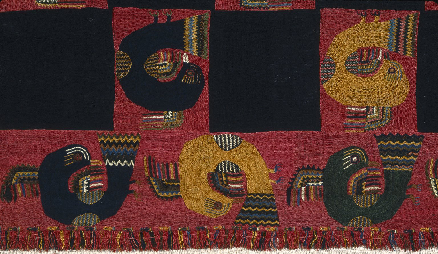 Paracas, detail of Block Color style embroidered mantle with falcons, c. 100 C.E., cotton, camelid fiber, 117 11/16 x 53 15/16 in. (298.9 x 137 cm) Brooklyn Museum