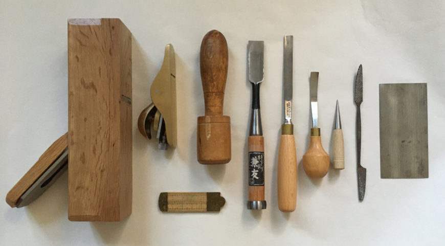 Tools used to shape wood (left to right): block plane, sole plane, ruler, mallet, flat chisel, straight gouge, curved gouge, awl, rasp, and cabinet scraper (photograph by author)