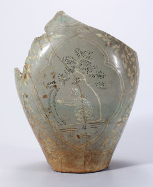 Celadon Jar with Inlaid Monkey and Tree Design in Overglaze Gold, Korea, Goryeo Dynasty, 918–1392, Stoneware uinlaid decoration and overglaze gold pigment on celadon glaze, H. 25.5 cm, (National Museum of Korea)