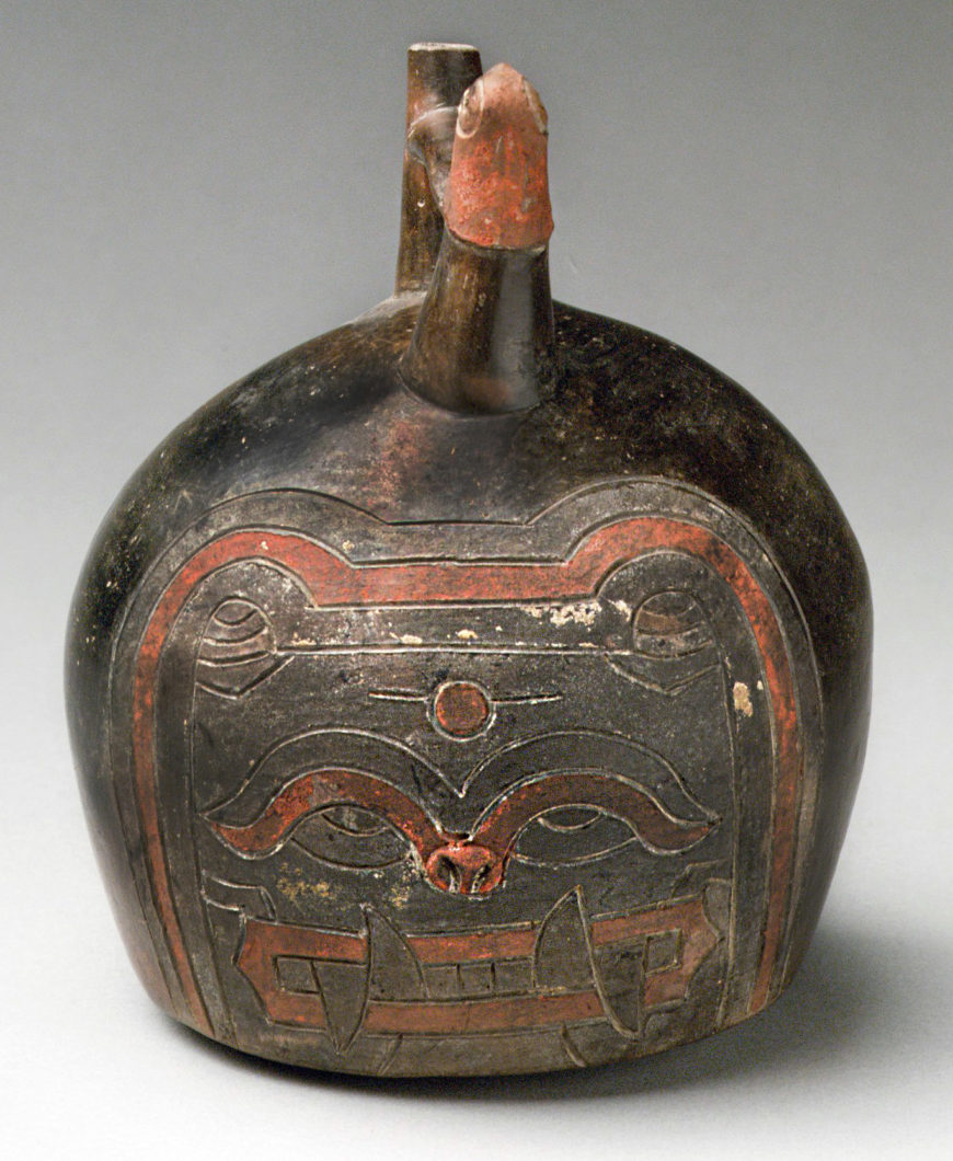 Feline face bottle, Paracas, 4th–3rd century B.C.E., ceramic and post-fired paint, 17.8 x 14.3 x 13.7 cm, from the Ica Valley, Peru (The Metropolitan Museum of Art)