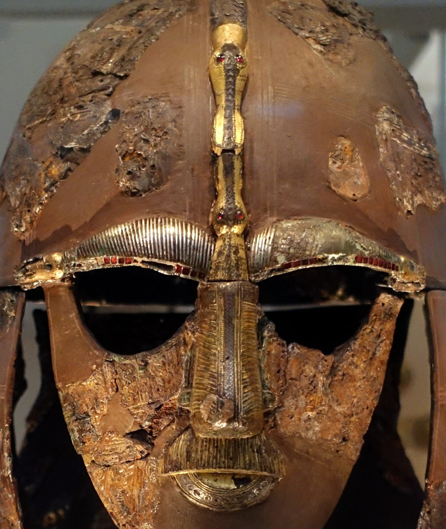 Face mask (detail), The Sutton Hoo helmet, early 7th century, iron and tinned copper alloy helmet, consisting of many pieces of iron, now built into a reconstruction, 31.8 x 21.5 cm (as restored) (The British Museum) (photo: Steven Zucker, CC BY-NC-SA 2.0)