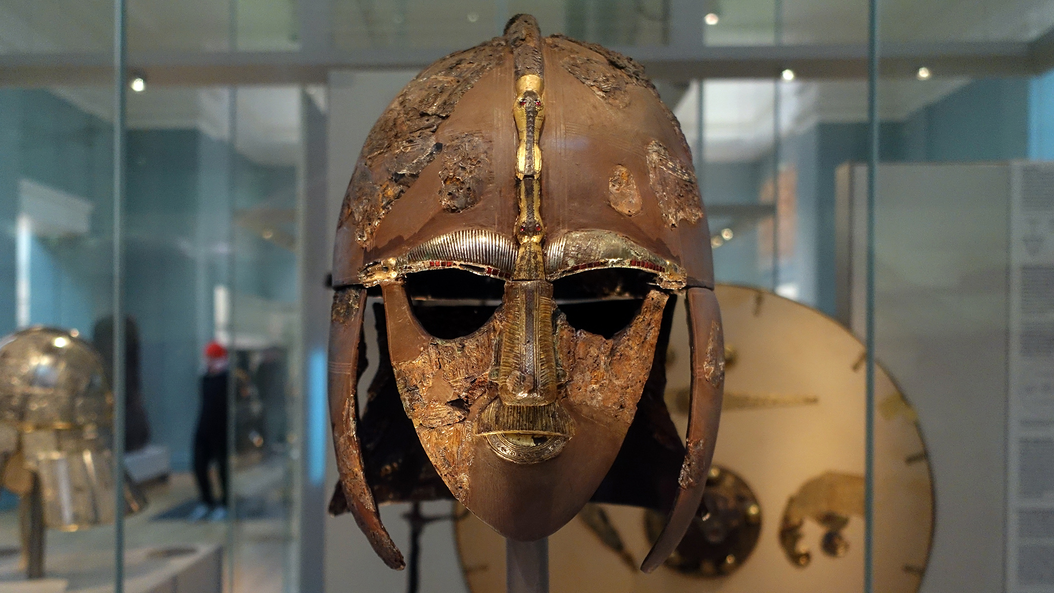 The Sutton Hoo helmet, early 7th century, iron and tinned copper alloy helmet, consisting of many pieces of iron, now built into a reconstruction, 31.8 x 21.5 cm (as restored) (The British Museum) (photo: Steven Zucker, CC BY-NC-SA 2.0)