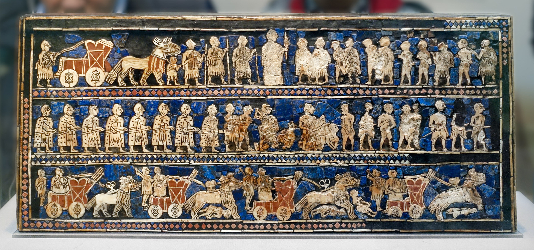 War (detail), The Standard of Ur, 2600–2400 B.C.E., shell, red limestone, lapis lazuli, and bitumen (original wood no longer exists), 21.59 x 49.53 x 12 cm (© The Trustees of the British Museum, London; photo: Steven Zucker, CC BY-NC-SA 2.0)