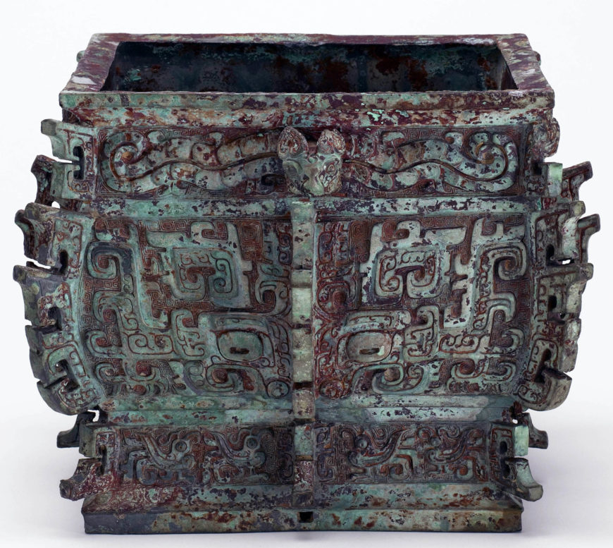 Square lidded ritual wine container (fangyi) with taotie, serpents, and birds, Early Western Zhou dynasty, ca. 1050-975 BCE, Bronze, China, Henan province, Luoyang, 35.3 high x 24.8 x 23.3 cm (Freer Gallery of Art, Smithsonian, Washington DC: Purchase — Charles Lang Freer Endowment, F1930.54a-b)