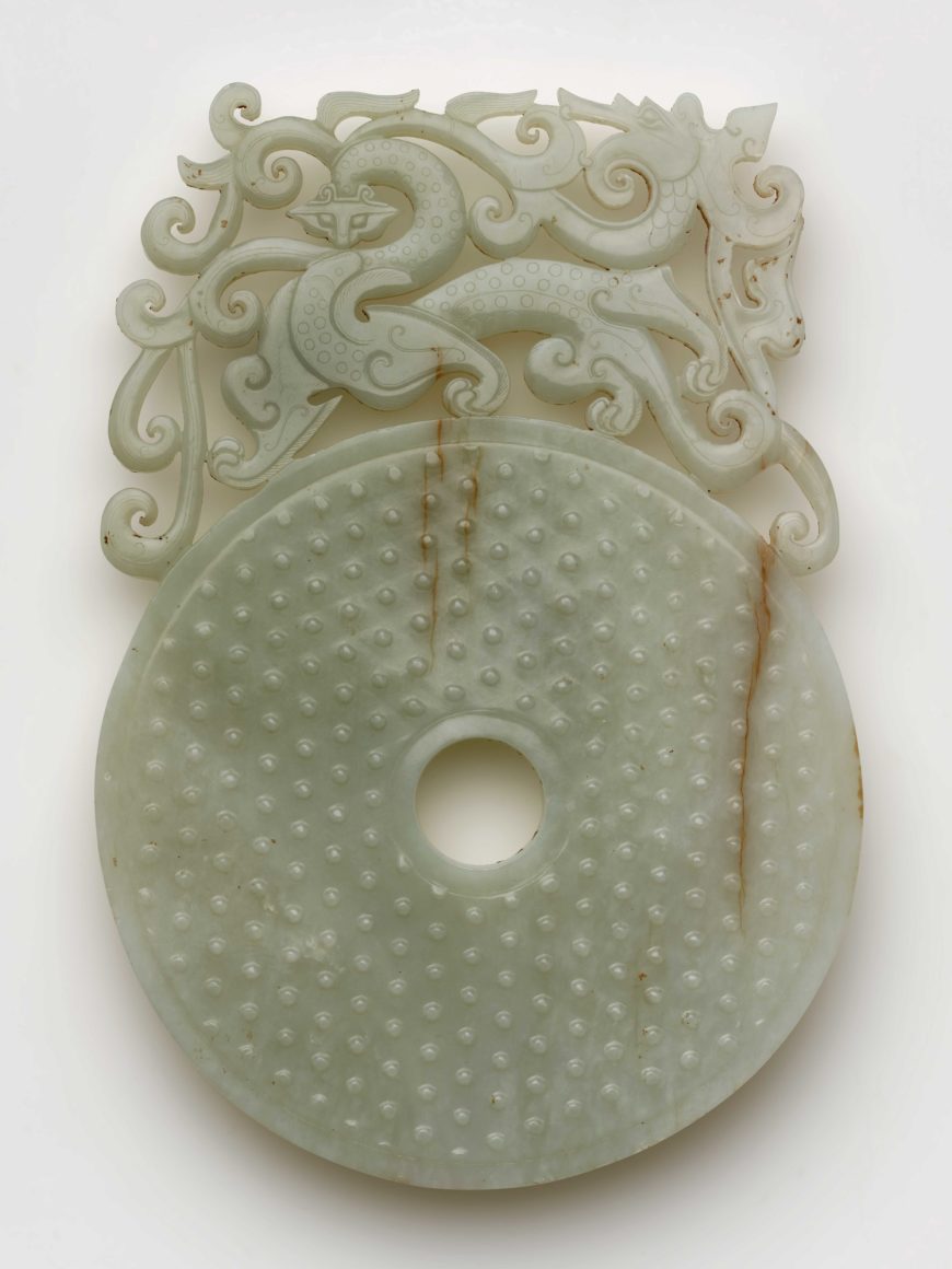 Disk (bi) with knobs, feline, and dragon, Eastern Han dynasty, 100-220, jade (nephrite), China, 22 high x 15.2 x 0.7 cm (Freer Gallery of Art, Smithsonian, Washington, DC: Gift of Charles Lang Freer, F1916.155)