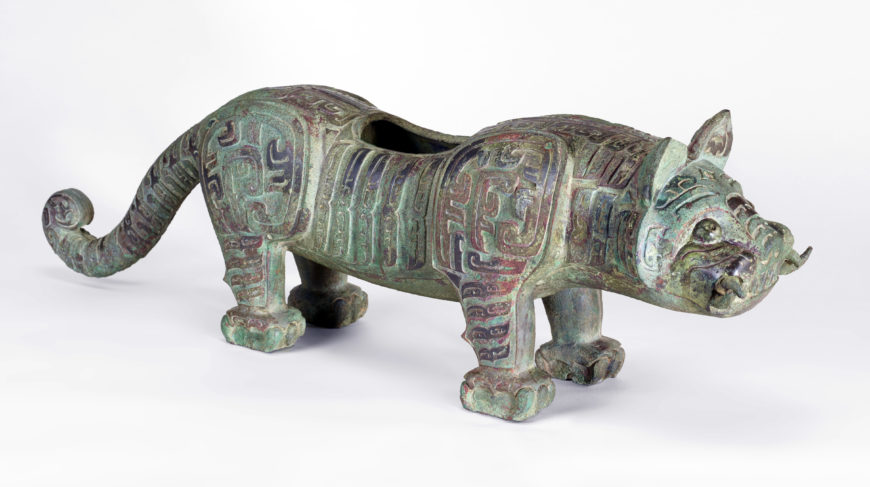 One of a pair of tigers, possibly the base supports for a bell stand, Middle Western Zhou dynasty, ca. 950-850 BCE, bronze, China, Shaanxi province, Baoji, 25.3 high x 15.9 x 75.2 cm (Freer Gallery of Art, Smithsonian, Washington, DC: Purchase — Charles Lang Freer Endowment, F1935.21)