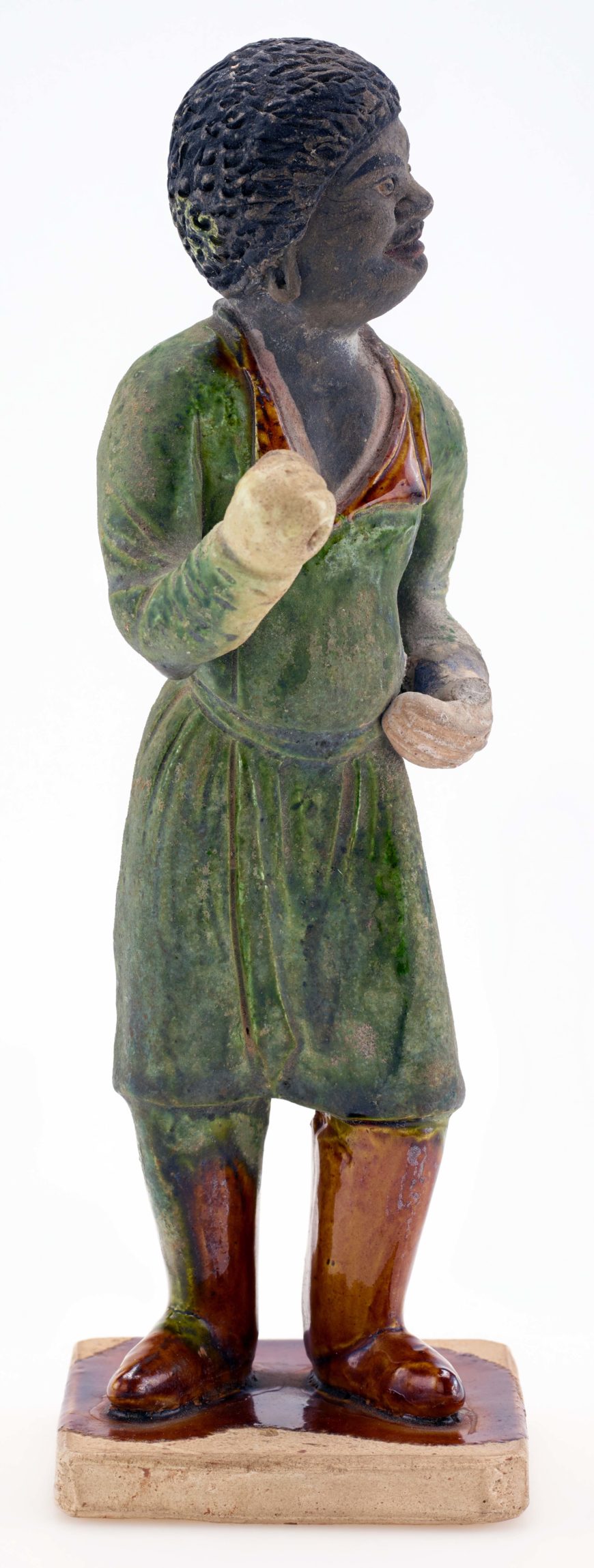 Tomb figure of a groom, Tang dynasty, ca. 700-750, Earthenware with lead-silicate glazes and painted details, China, 20.7 x 6.7 cm (Freer Gallery of Art, Smithsonian, Washington, DC: Purchase — Charles Lang Freer Endowment, F1952.14)