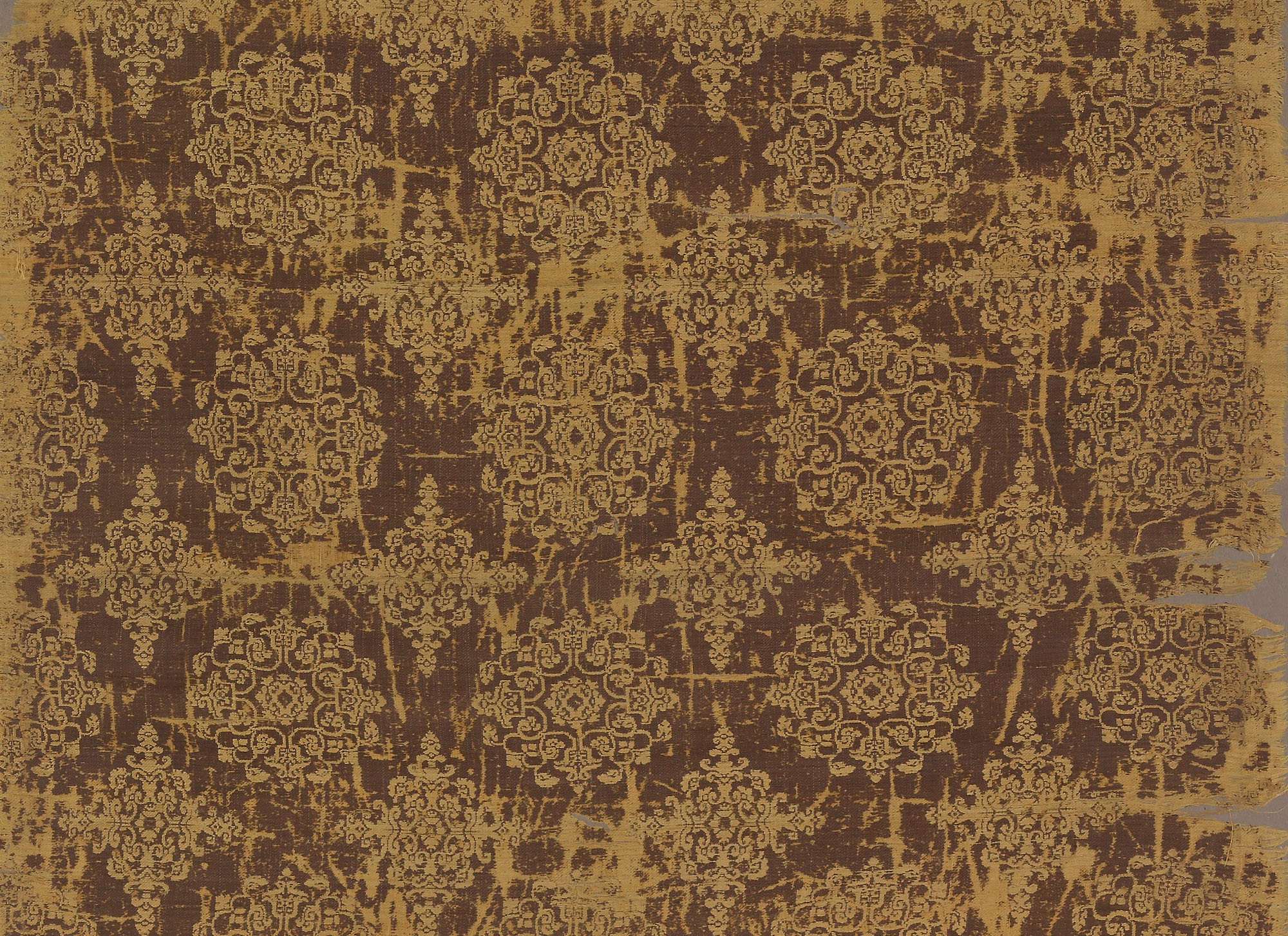 Textile with floral medallions and lozenges, mid-Tang dynasty, first half of the 8th century, brocade (jin): woven silk (weft-faced compound twill), China, 150.1 high x 59.3 cm (Freer Gallery of Art, Smithsonian, Washington, DC: Gift of Charles Lang Freer, F1911.597a-b)