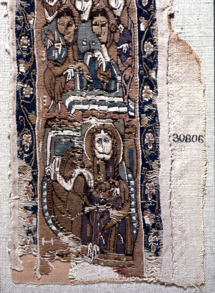 Polychrome tapestry band from linen garment decorated with representations of saints on red ground, Coptic period, 7th–8th century, Egypt, 90 x 12 cm