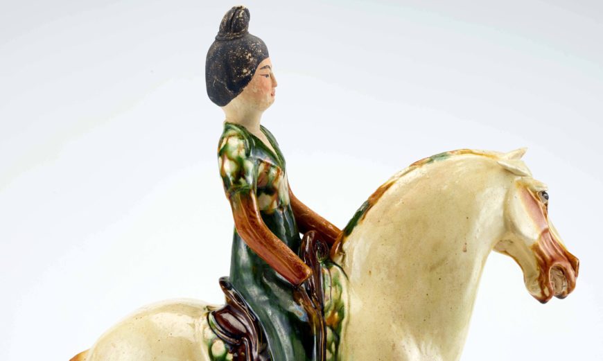 Tomb figure of a woman on horseback, Tang dynasty, ca. 700-750, Earthenware with lead-silicate glazes and painted details, China, Henan province, Possibly Luoyang, 43.1 high x 14.8 x 37.6 cm (Freer Gallery of Art, Smithsonian, Washington, DC: Purchase — Charles Lang Freer Endowment, F1952.13)