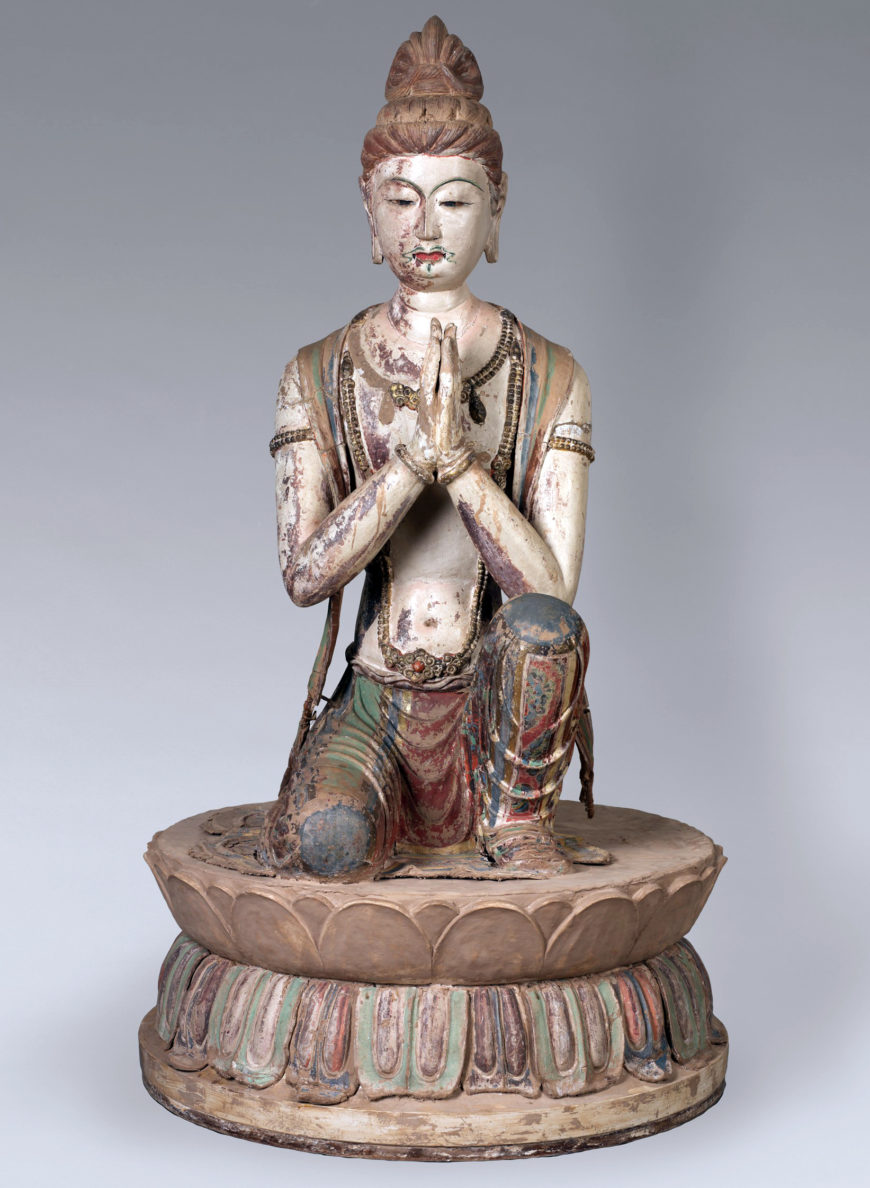 Kneeling Attendant Bodhisattva, late 7th century (Tang dynasty), unfired clay mixed with fibers and straw modeled over wooden armature; with polychromy and gilding, from Mogao Cave 328, Dunhuang, 122 cm high (Harvard Art Museums)