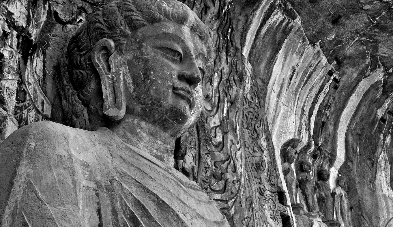 Buddha at the Longmen Grottoes. 493-534 CE. Northern Wei Dynasty. Luoyang, China.