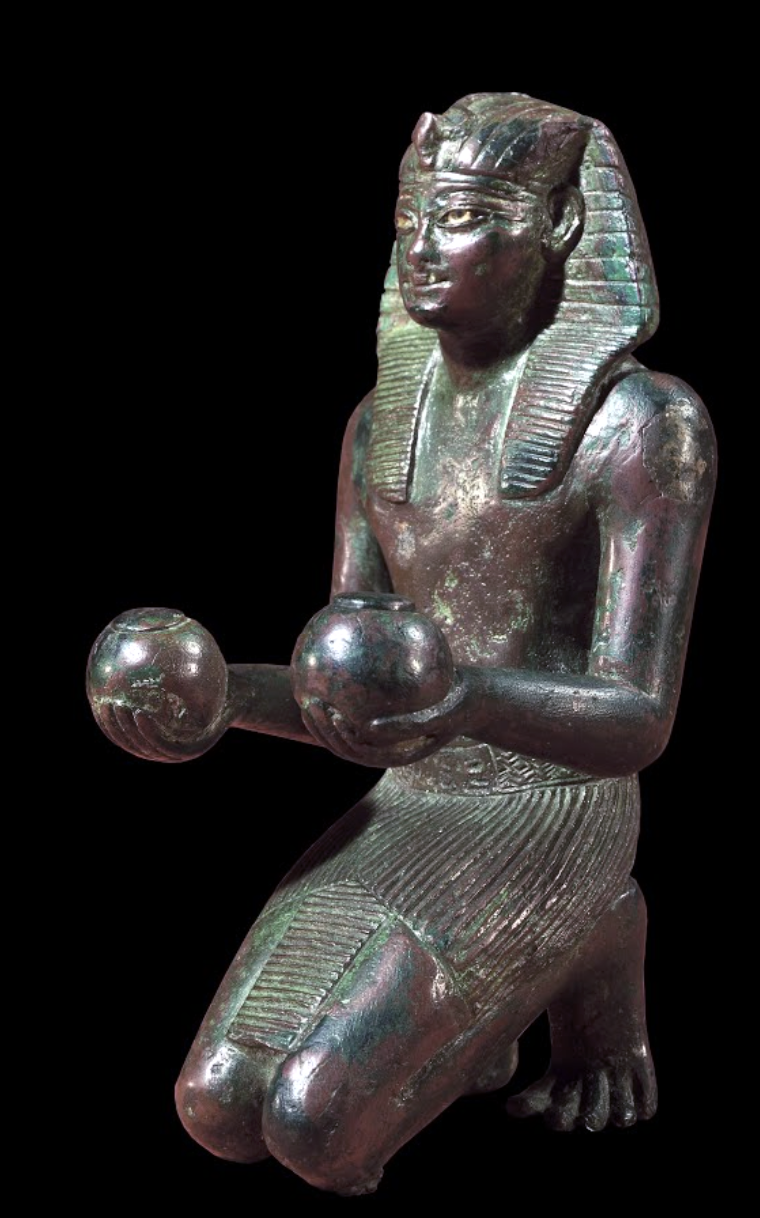 Statuette of Thutmose IV, 1400–1390 B.C.E., 19th Dynasty, ancient Egypt, bronze, silver, calcite, 14.7 x 6.4 cm (© Trustees of the British Museum)